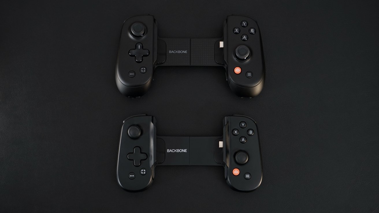 Two black gaming controllers with buttons and joysticks, displayed on a dark surface. They have 'Backbone' branding and are shown from a top-down perspective.