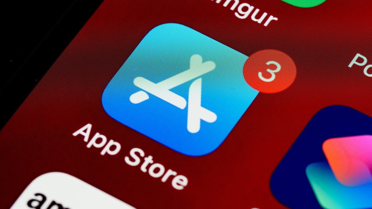 App Store icon on a mobile screen displays a notification badge with the number three against a red background.